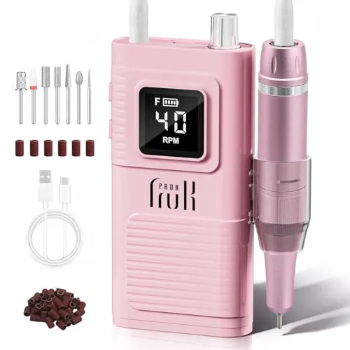 Pink cordless electric nail drill with bits and LCD display, shown on marble vanity