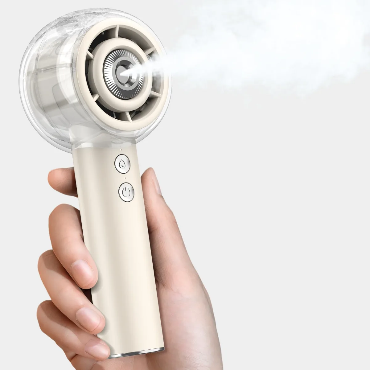 Person using a misting fan portable with visible water spray and handheld design for outdoor cooling