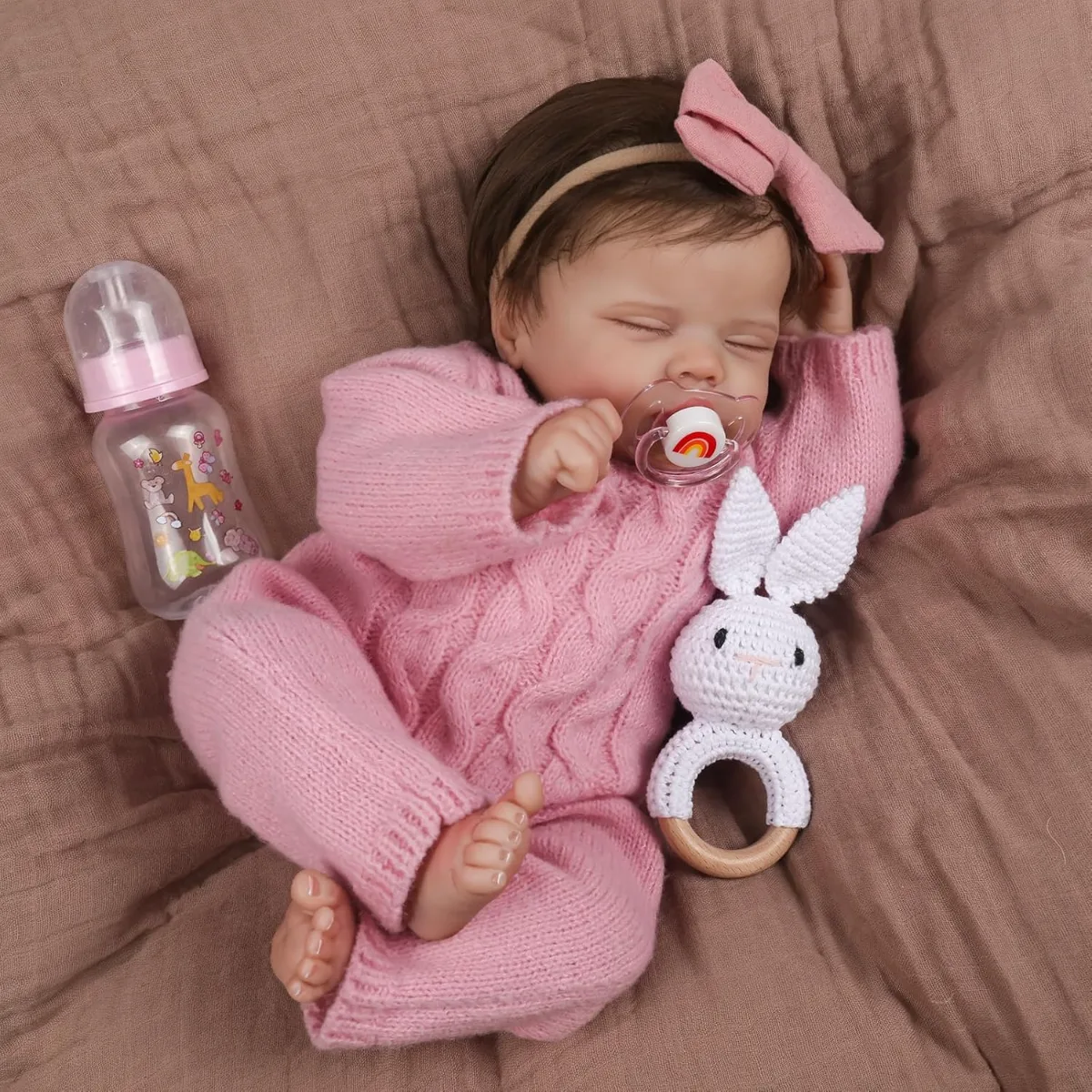 WOOROY Realistic Reborn Baby Doll Aria sleeping peacefully in a knitted blanket, showcasing lifelike details
